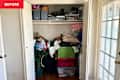 Clutter in closet before decluttering using pomodoro method.