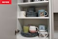 Using the Reverse Decluttering Method to organize cabinet.