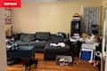 Messy living room before organizing using pro organizers advice.