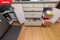 Unorganized deep kitchen cabinets and drawers before implementing pro organizer advice