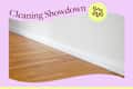 Doussie parquet floor with reddish surface and white walls, closeup of baseboard with Showdown lead.