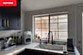 Kitchen corner with black cabinets.