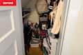 Messy closet before being organized.