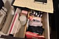 Toiletries organized in drawer.