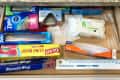 Before: drawer with cling wrap and aluminum foil