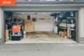 Before: garage with shelves full of containers
