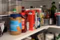 Before: white shelves with food staples like peanut butter, oils, and syrups