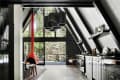 Kitchen area with black cabinets and countertop