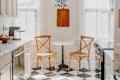 Star shaped light fixture above kitchen bistro table.