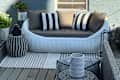 Woven Rattan Round 75.2" Outdoor Sofa on a porch.