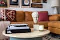 Danielle Blundell Living room with a tan Article sofa and gallery wall