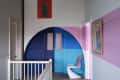 Colorful hallway using paint from the Christopher John Rogers Collection for Farrow & Ball