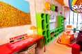 Colorful living room in Skittles Littles apartment, designed by Dani Klaric.