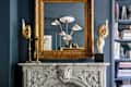 Blue living room with ceiling medallion showing in mirror reflection