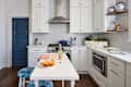 White cabinets in newly renovated kitchen.