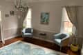 Blue armchairs in vintage inspired family room.