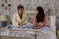 Rain Spencer (Taylor), Lola Tung (Belly) in bedroom with blue and cream tropical wallpaper