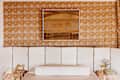 warm-toned bedroom with room divider as headboard