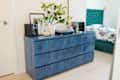 Blue tile peel and stick backsplash on bedroom dresser.