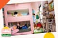 kids playing in a room with pink bunk bed, lots of books