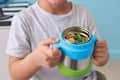 Kid holding a b.box Insulated Food Jar