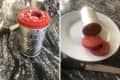 Frozen cranberry sauce in a can, sliced on a white plate with a knife on a marble countertop.