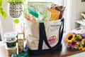 Trader Joes groceries in large canvas bag.