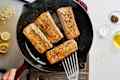 Mahi mahi fillets cooking in a cast iron pan