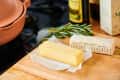 Sticks of butter on a wooden cutting board
