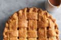 Salted caramel apple pie in a pie dish on a table