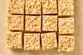 photo of cut rice krispy treats on parchment paper