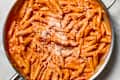 overhead shot of penne alla vodka in a pan.