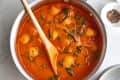 Trader Joe's tomato soup gnocchi with spinach in a pot