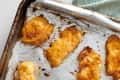 Close up shot of Betty Crocker chicken tenders on baking sheet.