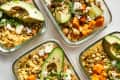 Chickpea and roasted vegetable salads in lunch containers ready to be packed for lunch