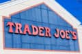 Trader Joe's store sign with red letters on a blue background.