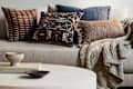 West Elm pillows and throw on a sofa