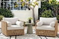 2 west elm rattan and white chairs outside