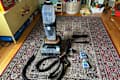 Bissell hydrosteam vacuum on rug.