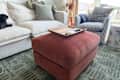 Tray on top of pink Joybird ottoman in living room.