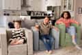 Children sitting on Nugget Smore's chair.