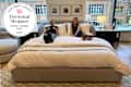 Emma and Sarah on Loxley Bed at the Room & Board NYC store. Personal Shopper seal in upper left