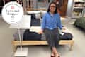 Furniture tester sitting on IKEA bed in store with personal shopper seal in upper left