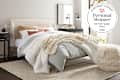Pottery Barn bed in bright airy bedroom with personal shopper seal in upper right