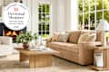 living room with Pottery Barn furniture featuring a coffee table