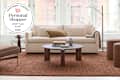 Living room with West Elm furniture and rug with personal shopper seal in upper left