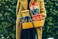 Woman holding Christmas gifts.