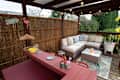 A general view of an outside garden home bar with timber wooden pergola