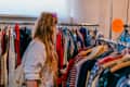Young woman shopping in a vintage clothing store