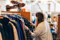 Woman Shopping for Clothes in a Vintage Store